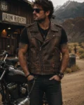 Men's vintage brown leather biker vest featuring distressed leather, asymmetrical zipper closure, side lace detailing, buckle accents, and classic motorcycle-inspired styling.