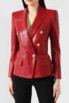 Women's red genuine leather double-breasted blazer jacket with metallic buttons, tailored fit, notch lapel collar, and full-length sleeves.